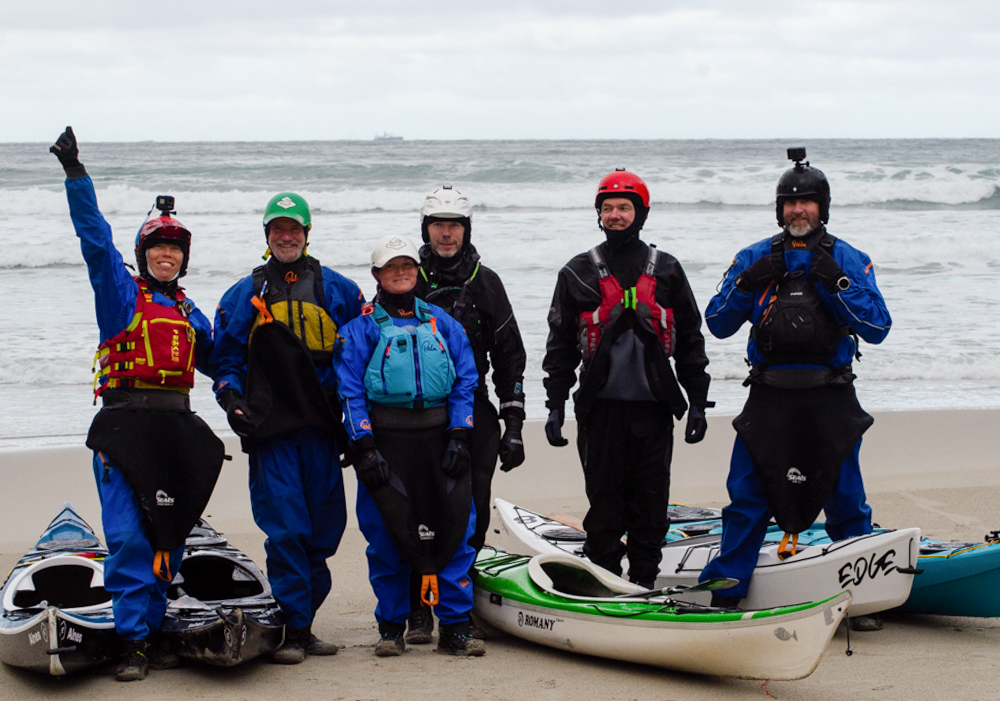 The Surf Symposium group on the beach in Hoddevik with their Edge kayaks