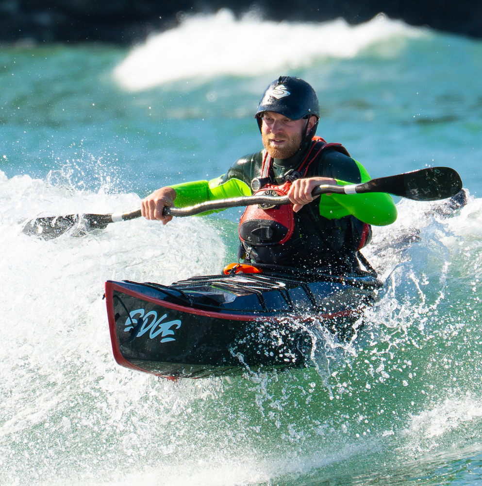 Tim surfing his black Edge Alnes