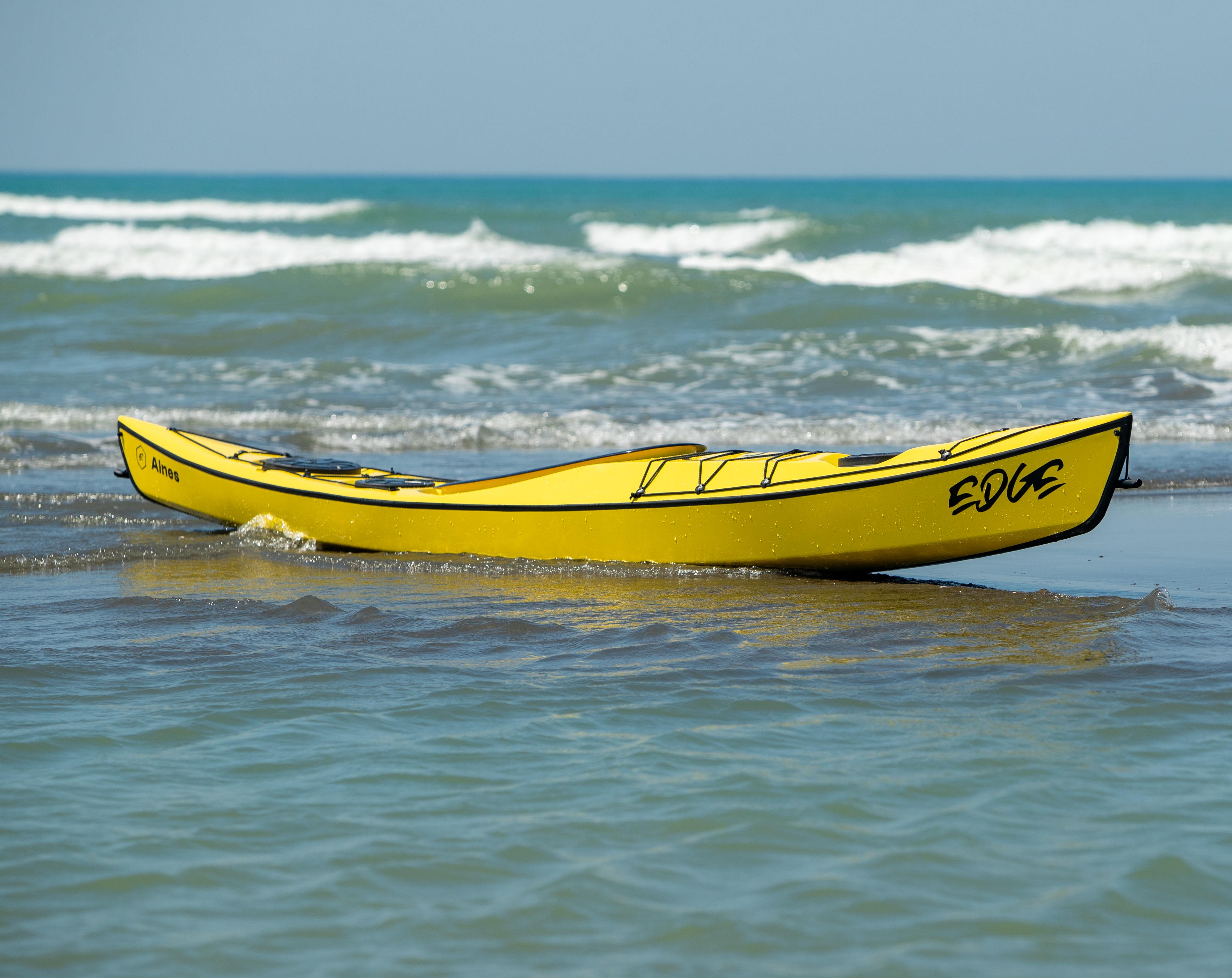 A yellow Edge Alnes at the water's edge