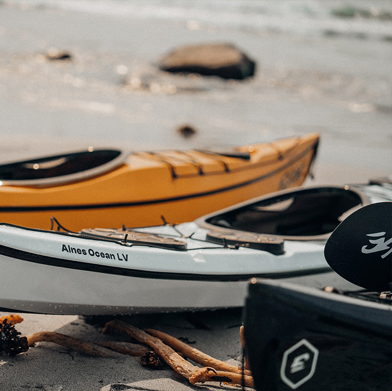 An orange and a grey Edge Alnes on the beach